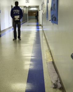 Towels soak up leaks in the hallways of Federal Way High School.