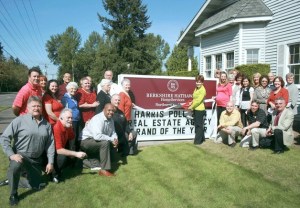 Real estate agents and staff at Berkshire Hathaway HomeServices in Federal Way celebrate a ribbon-cutting ceremony on April 29
