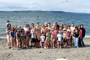 Members of the Marine Hills Swim and Tennis Club pose for a group photo before participating in the polar bear plunge.