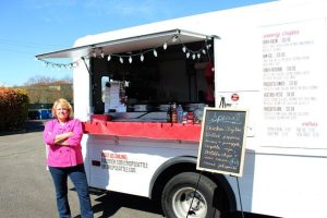 Crisp Creperie owner Debi Hernandez stands in front of her food truck at The Commons mall parking lot location in Federal Way. Her specialty crepes incorporate flavors from sweet to savory and serve Seattle
