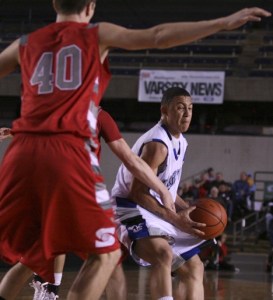 Federal Way senior point guard Isiah Umipig takes the ball to the basket during the Eagles' 64-44 opening-round state tournament win over Stanwood Wednesday at the Tacoma Dome.