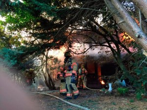 South King Fire and Rescue battle a fully-involved house fire at South 288th Street and 18th Avenue South. One person died in the fire