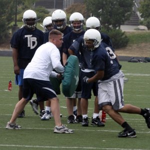 Todd Beamer football players practice Thursday. The team