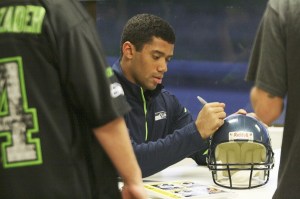 Seattle Seahawks rookie quarterback Russell Wilson was in Federal Way Monday evening at Walt's Auto Care Center signing autographs and posing for photos.