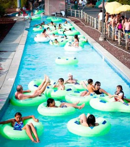 People relax on water tubes at Wild Waves Theme Park's Konga Lazy River. The water park is expecting visitors to flock to the summer attraction this weekend as temperatures soar.