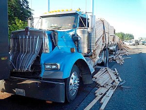 Semi-truck accident leaves lumber and fuel on I-5 near Wild Waves.