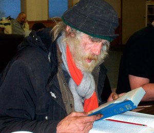 A homeless man reads at New Hope Church in Federal Way