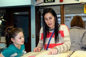 Community members look at Camelot Elementary memorabilia during the school's recent 50th anniversary.