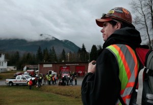 Federal Way resident Derek Stephani waits to be assigned to a crew on Tuesday morning. Stephani drove to the site to help find mudslide victims after he heard the call on the radio.
