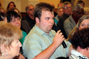 A resident asks a question during the Mirror's candidate debate on Wednesday at the Twin Lakes Golf and Country Club.