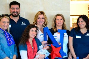 Assistance League of South Puget Sound volunteers pose for a photo in front of the Kohl's store in Federal Way last year. On Saturday