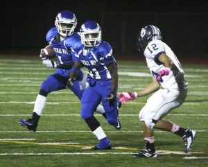 Federal Way junior wide receiver Marcel Morris runs the ball while freshman Chico McClather blocks a Todd Beamer defender during the Eagles’ 45-0 win Friday at Federal Way Memorial Stadium. Morris finished with a touchdown catch.