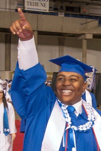 A Federal Way High School senior celebrates during the school's commencement ceremony at the Tacoma Dome on June 14.
