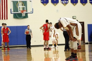 Tarence Taylor looks down as Yelm puts the game out of reach with two late free throws.