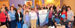 The Kiwanis Aktion Club (pictured) recently assembled hygiene packs during a meeting at the Federal Way Community Center. The packs were donated to the Reach Out organization and will benefit people in need.