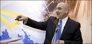 Federal Way Public Schools (FWPS) Superintendent Rob Neu clicks to the next slide of his presentation at the Federal Way Chamber's membership luncheon Jan. 9 at Twin Lakes Golf and Country Club.