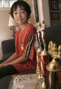 Lakota Middle School seventh-grader Grant Hall and the trophies he earned in math competitions.