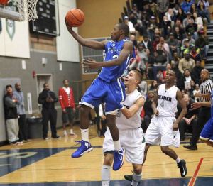 Federal Way senior D'Londo Tucker goes up for a layin during the Eagles' 50-48 loss to Todd Beamer Friday night at Beamer.