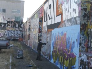 Elrik working on a piece at the Seattle free wall.