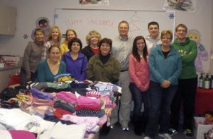 Pictured is the Enterprise “Elf Crew” who met Dec. 15 to organize the gifts and donations for the families to pick up.