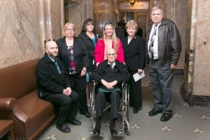 Retired Army Master Sgt. James Hayden and his family with Rep. Linda Kochmar.