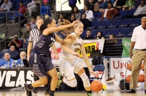 Mikayla Pivec drives to the basket while being defended by Todd Beamer's Lexus Holden during Lynnwood's 62-38 victory at the ShoWare Center's King Showcase on Jan. 18.