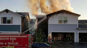 South King Fire and Rescue responded to a two-house fire on Monday evening that left 11 adults and four children displaced.