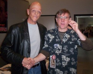 Federal Way author B.L.Morgan (Bob Morgan) shakes hands with Michael Berryman