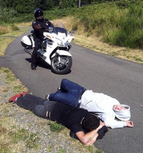 A Federal Way police officer arrives to find two 18-year-old men asleep Wednesday morning on the BPA Trail.