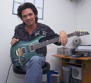 Steve Lynch relaxes in his guitar teaching room at the Federal Way School of Music
