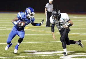 Federal Way senior D’Londo Tucker stiff arms a Spanaway Lake defender during the Eagles’ 42-13 win over the Sentinels Friday night. The unbeaten Eagles play Auburn (6-1) at 7 p.m. Friday night at Auburn's Troy Field.