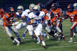 Caleb Brown carries the ball for Tahoma early in the first quarter of their 50-10 win over Decatur on Thursday Sept. 24 at Federal Way Memorial Stadium.
