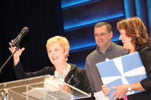 Reach Out officials recognize the organization's community development director Nancy Jaenicke