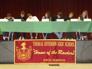 Seven seniors at Thomas Jefferson High School signed their letters of intent to compete in athletics next year at various colleges Wednesday night at the school. From left to right