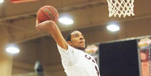Todd Beamer graduate Kevin Davis goes up for a dunk during one of Central’s game this season. Davis is averaging 13 points and 10 rebounds a game for the 7-3 Wildcats this season.