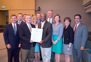 King County Councilmembers present Washington State University representatives with a recognition honoring university President Elson Floyd. Left to right (back row