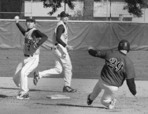 Decatur second baseman Ryan Kim attempts to turn a double play during the Gators’ loss to Kentlake Wednesday afternoon. Decatur is 1-7 in the SPSL North.