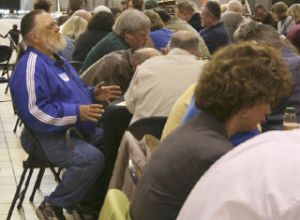 Thadius Henness of Federal Way extends his hands as he prays May 1 during Federal Way’s annual Prayer Breakfast at The Commons mall. About 140 people gathered to pray for the city