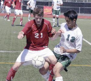 Beamer senior Chris Tartaglia (right) battles with Eastlake’s Jordan Strong during Saturday’s third/fourth match at Harry Lang Stadium in Lakewood. Eastlake won 2-1.
