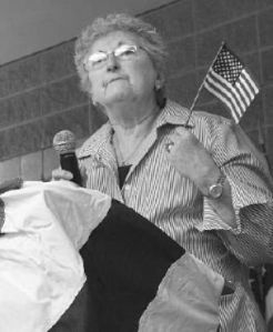 Federal Way resident Marta Foldi speaks about the meaning of the flag to her family