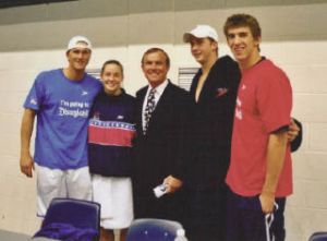 King County Councilmember Pete von Reichbauer (middle) stands with Olympians Lenny Krazylburg