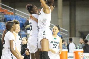 Beamer players celebrate after their 40-35 win over Skyview in the quarterfinals of the state playoffs on March 3 at the Tacoma Dome. TERRENCE HILL