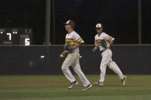 Emmanuel Hinojoza (left) and Mason Delacruz (right) smile after recording the final out in their 6-1 win over Kentlake on May 11 at Art Wright Field.