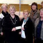 GFWC Sokico members (from left) Linda Butcher, Kathie Jorgensen, Carolyn Johnson and Nancy Jones after presenting a $10,375 check to Federal Way Day Center Advisory Committee members Nancy Jaenicke, Jackie Blair, Lynn Ormsby and Martin Petrich. Contributed photo