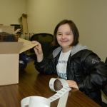 Morgan Kenske, 19, does labeling and stuffs envelopes on Oct. 27 at Caffe D&rsquo;arté. Photo courtesy of Rick Priest