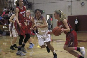 Thomas Jefferson's Crystal Lee guards against Eastmont's Kaitlyn Cox during the first half of the Wildcats 54-38 win on Friday