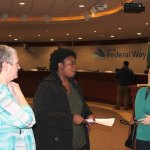 Violence Prevention Coalition steering committee member Dianne Zoro (left) discusses youth violence with community members at the first public VPC session on Oct. 26. RAECHEL DAWSON, the Mirror