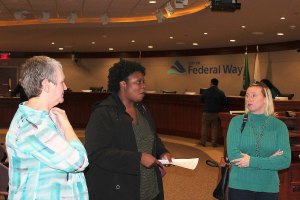 Violence Prevention Coalition steering committee member Dianne Zoro (left) discusses youth violence with community members at the first public VPC session on Oct. 26. RAECHEL DAWSON, the Mirror