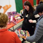 Parents pick out toys for their children at the Federal Way Cares for Kids holiday event on Dec. 10. Courtesy of Bruce Honda