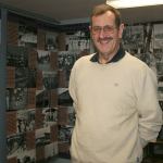 Bert Ross, a volunteer for the Federal Way Historical Society, stands amid the pictures on display at the society. Ross has been a volunteer for the Historical Society since 2009. JESSICA KELLER, the Mirror